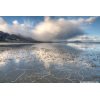 Wet cracks, water, and cloud with mountain