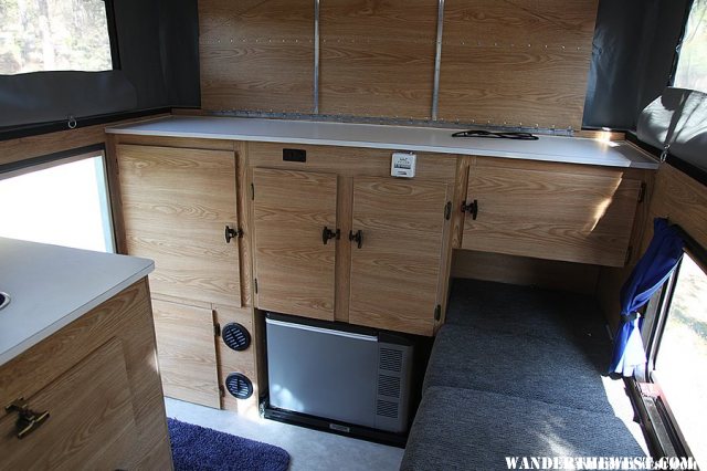 Rear cabinet with recessed Engel fridge