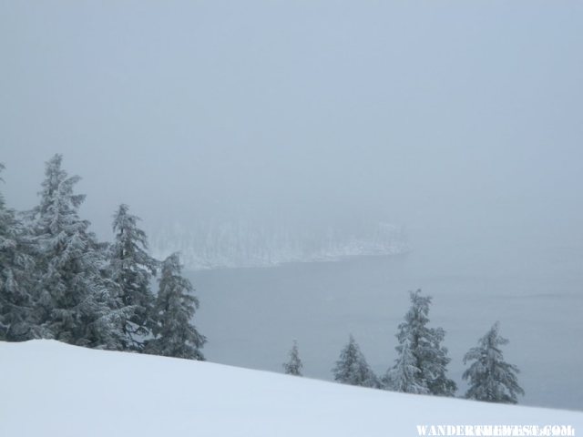 Limited view of Crater Lake and Wizard Island.