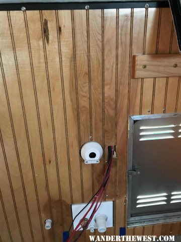 Repositioning wiring, and splicing in paneling to remove hole