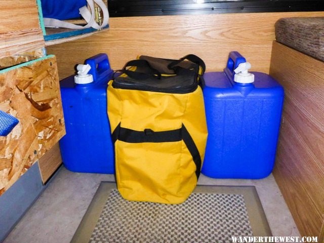 Water jugs and cube.  The 5 gln container fits between the bottom drawer and front wall