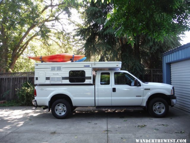 River boats on camper in driveway