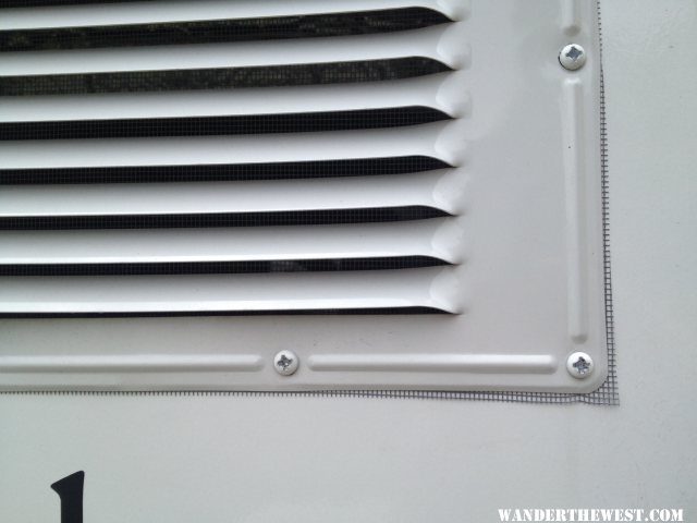 screen behind upper fridge vent