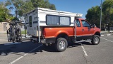 small F250 with camper and bikes.jpg